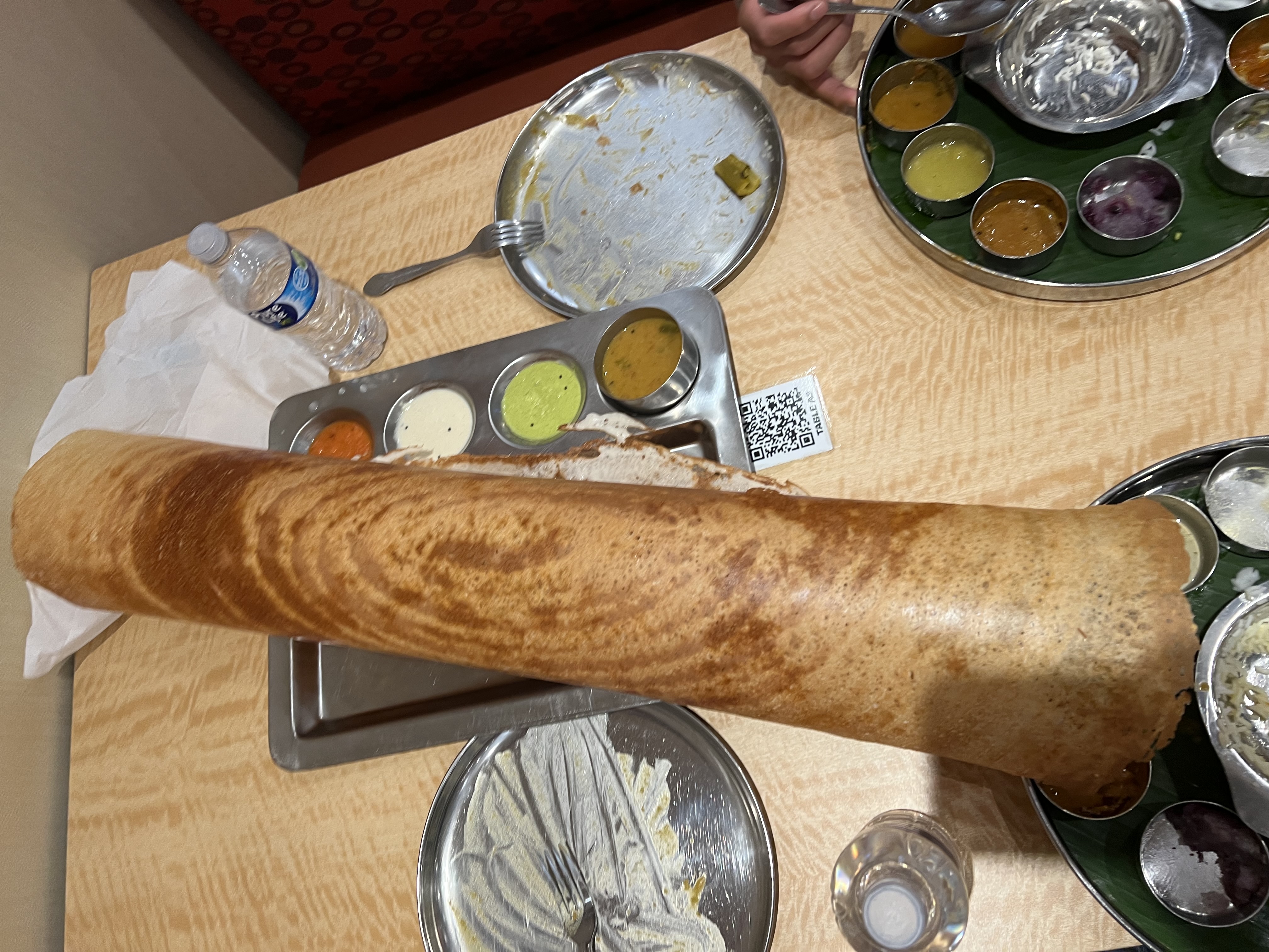 Giant paper roast dosa served with chutneys and sambar