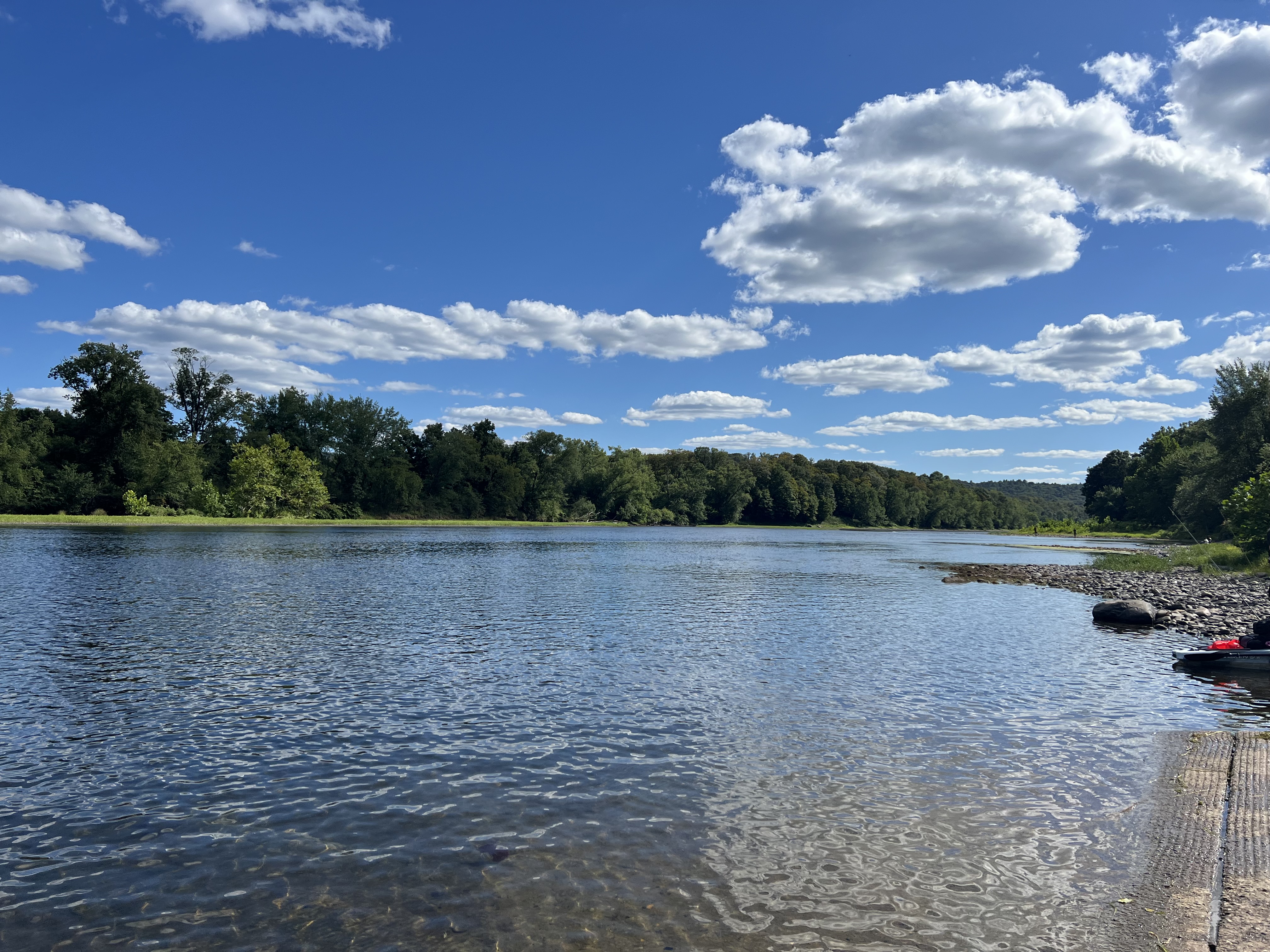 Serene river view under a clear blue sky